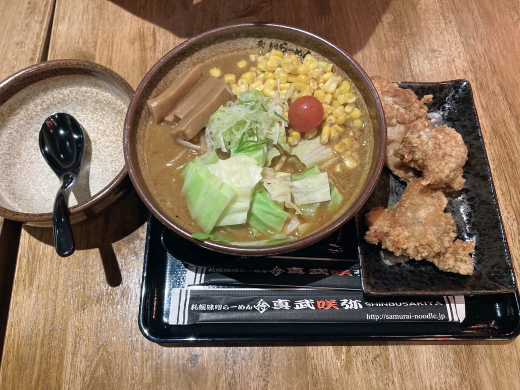 shinbusakiya miso ramen with a side of chicken